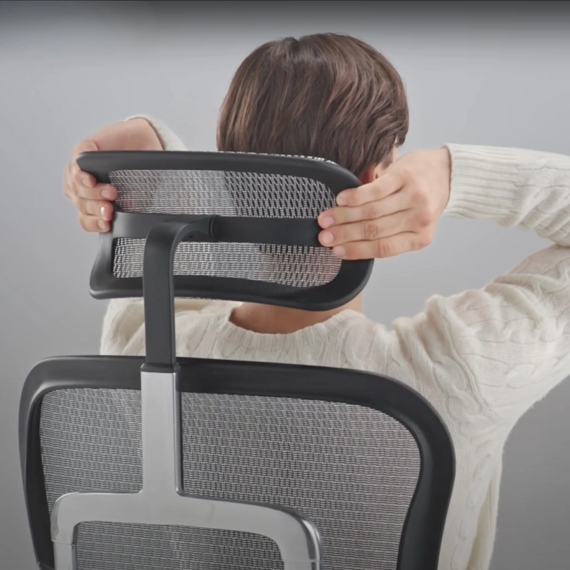 Réglage de la têtière d'un fauteuil ergonomique